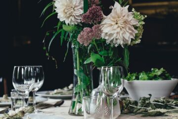 white and brown flowers on white table