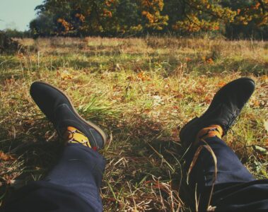 person sitting on grass field